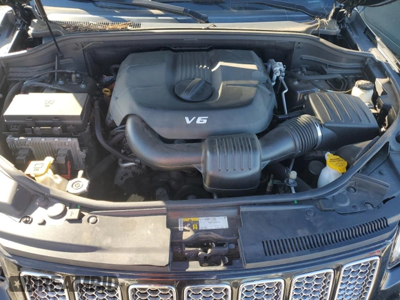 2015 Jeep Grand Cherokee Summit with VIN 1C4RJFJG0FC700014, listed as a Copart auction lot 42981765 with 144,937 mi miles and Salvage Title. Bid and sale history available at DreamBid. Image 12.