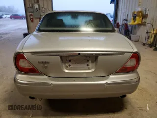 2004 Jaguar XJ with VIN SAJEA71C84SG07220, listed as a Copart auction lot 70916164 with 151,102 mi miles and Salvage Title. Bid and sale history available at carsss.com. Image 6.
