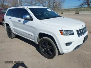 2015 Jeep Grand Cherokee Overland with VIN 1C4RJFCM2FC737133, listed as a IAAI auction lot 42012000 with 132,928 mi miles and . Bid and sale history available at DreamBid. Image 1.