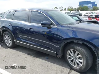 2016 Mazda CX-9 Sport with VIN JM3TCABY3G0123239, listed as a IAAI auction lot 42570700 with 119,414 mi miles and . Bid and sale history available at DreamBid. Image 14.