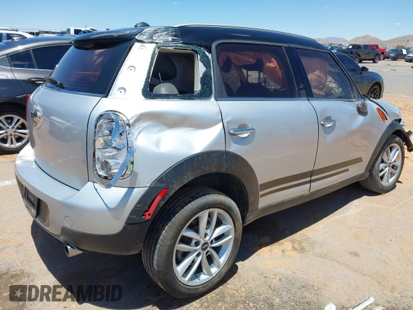 2014 MINI Countryman with VIN WMWZB3C53EWR40742, listed as a IAAI auction lot 42384059 with Not provided miles and . Bid and sale history available at DreamBid. Image 4.
