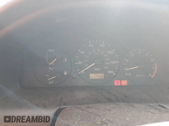 1998 Mazda Protege DX z VIN JM1BC1416W0194406, wystawiony jako Copart lot #44535955 z przebiegiem 312 942 mil mil oraz Szkoda całkowita • Salvage title. Historia ofert i sprzedaży dostępna na DreamBid. Obrazek 9.
