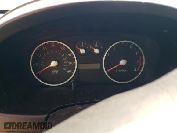2003 Hyundai Tiburon GT z VIN KMHHN65F13U084620, wystawiony jako Copart lot #46880185 z przebiegiem Nie podano mil oraz Nie do naprawy • Non repairable. Historia ofert i sprzedaży dostępna na DreamBid. Obrazek 9.