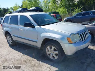 2009 Jeep Grand Cherokee Laredo with VIN 1J8GS48K99C528145, listed as a IAAI auction lot 42077024 with 167,588 mi miles. Bid and sale history available at carsss.com. Image 1.