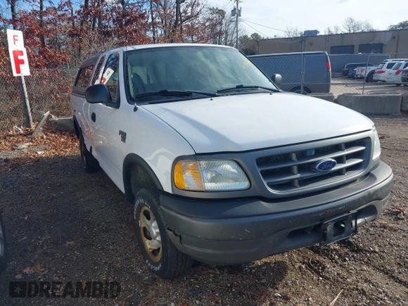 2003 Ford F-150 XL with VIN 2FTRX18W43CA62452, listed as a IAAI auction lot 41497879 with 125,828 mi miles. Bid and sale history available at carsss.com. Image 1.