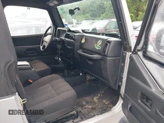 2005 Jeep Wrangler X z VIN 1J4FA39S95P370868, wystawiony jako IAAI lot #42476186 z przebiegiem 144 986 mil mil oraz . Historia ofert i sprzedaży dostępna na DreamBid. Obrazek 5.