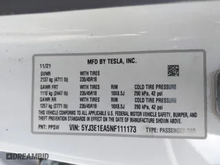 2022 Tesla Model 3 with VIN 5YJ3E1EA5NF111173, listed as a IAAI auction lot 41030634 with 99,337 mi miles. Bid and sale history available at carsss.com. Image 9.