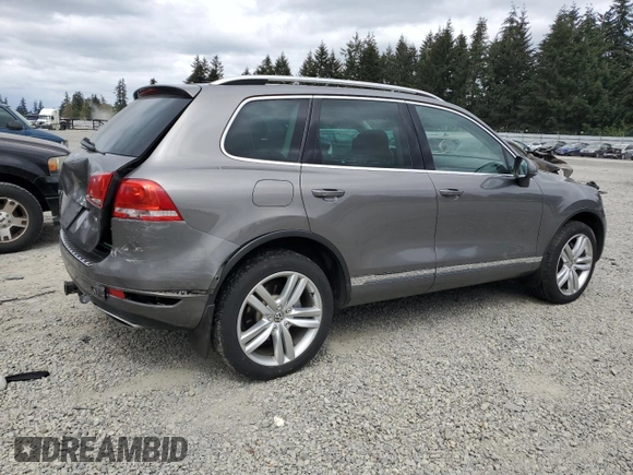 2012 Volkswagen Touareg Sport with VIN WVGFK9BP4CD001860, listed as a Copart auction lot 55090375 with 153,456 mi miles and Salvage title. Bid and sale history available at DreamBid. Image 3.