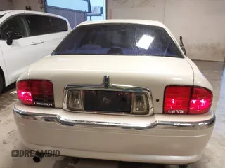 2002 Lincoln LS w/Base Pkg z VIN 1LNHM87AX2Y620293, wystawiony jako IAAI lot #41461349 z przebiegiem 129 295 mil mil oraz . Historia ofert i sprzedaży dostępna na DreamBid. Obrazek 6.