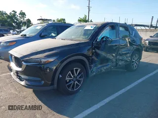 2018 Mazda CX-5 Grand Touring with VIN JM3KFBDM1J0345014, listed as a IAAI auction lot 42703926 with 151,453 mi miles and . Bid and sale history available at DreamBid. Image 2.
