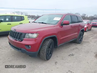2013 Jeep Grand Cherokee Laredo with VIN 1C4RJEAG4DC573971, listed as a IAAI auction lot 41627288 with 143,256 mi miles. Bid and sale history available at carsss.com. Image 2.