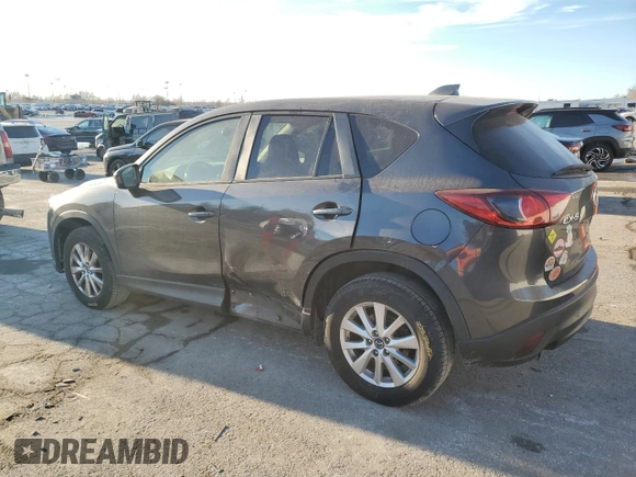 2015 Mazda CX-5 Touring with VIN JM3KE2CY0F0439125, listed as a Copart auction lot 43324945 with 210,404 mi miles and Clean Title. Bid and sale history available at DreamBid. Image 2.