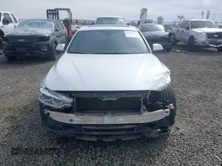 2018 BMW 3 Series 330i xDrive with VIN WBA8D9G50JNU72780, listed as a IAAI auction lot 41763726 with 65,225 mi miles and . Bid and sale history available at DreamBid. Image 13.