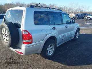2003 Mitsubishi Montero z VIN JA4NW31S93J037224, wystawiony jako IAAI lot #41848661 z przebiegiem 206 151 mil mil oraz . Historia ofert i sprzedaży dostępna na DreamBid. Obrazek 4.