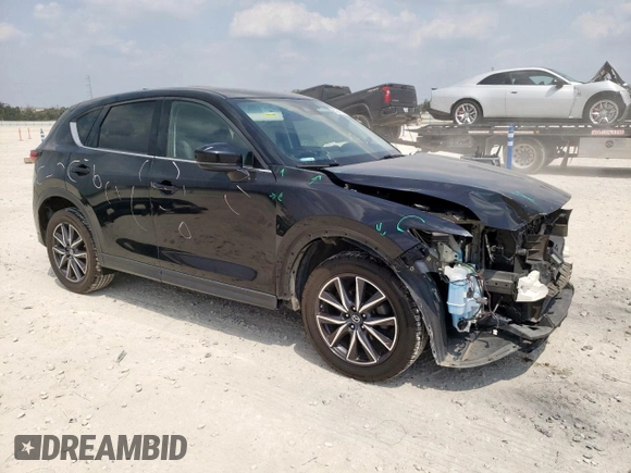 2018 Mazda CX-5 Grand Touring with VIN JM3KFBDM6J0414523, listed as a Copart auction lot 57581145 with 69,353 mi miles and Salvage title. Bid and sale history available at DreamBid. Image 4.