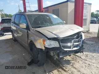2014 Dodge Grand Caravan SXT with VIN 2C4RDGCG8ER244201, listed as a IAAI auction lot 42017091 with 161,653 mi miles and . Bid and sale history available at DreamBid. Image 1.