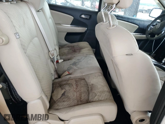 2013 Dodge Journey American Value with VIN 3C4PDCAB5DT656997, listed as a Copart auction lot 57123565 with 201,799 mi miles and Salvage title. Bid and sale history available at DreamBid. Image 11.