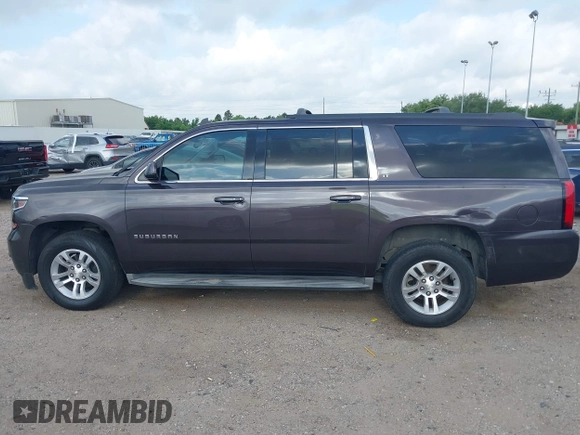 2015 Chevrolet Suburban LT with VIN 1GNSCJKCXFR175154, listed as a IAAI auction lot 42280418 with 227,373 mi miles and . Bid and sale history available at DreamBid. Image 14.