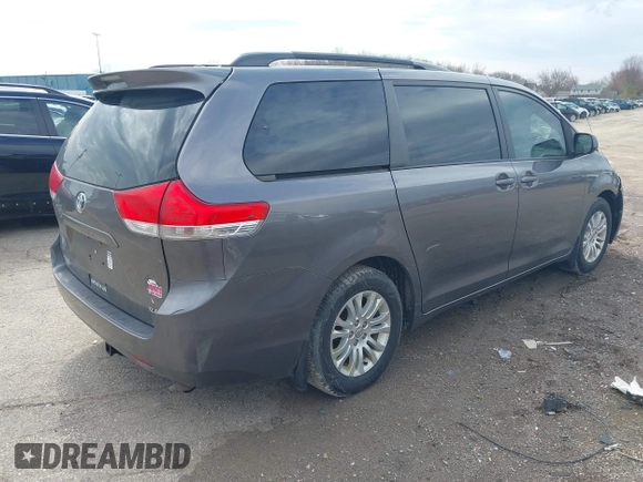 2014 Toyota Sienna XLE with VIN 5TDYK3DC4ES463315, listed as a IAAI auction lot 42108050 with 197,140 mi miles. Bid and sale history available at carsss.com. Image 4.