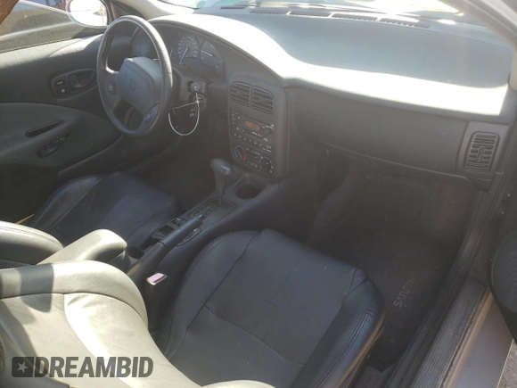 2001 Saturn SC z VIN 1G8ZY14751Z338353, wystawiony jako Copart lot #75086154 z przebiegiem 100 044 mil mil oraz Tytuł czysty. Historia ofert i sprzedaży dostępna na DreamBid. Obrazek 8.