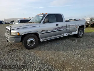 2001 Dodge Ram 3500 with VIN 1B7MC33W71J574245, listed as a Copart auction lot 84877774 with 200,945 mi miles and Salvage Title. Bid and sale history available at carsss.com. Image 1.