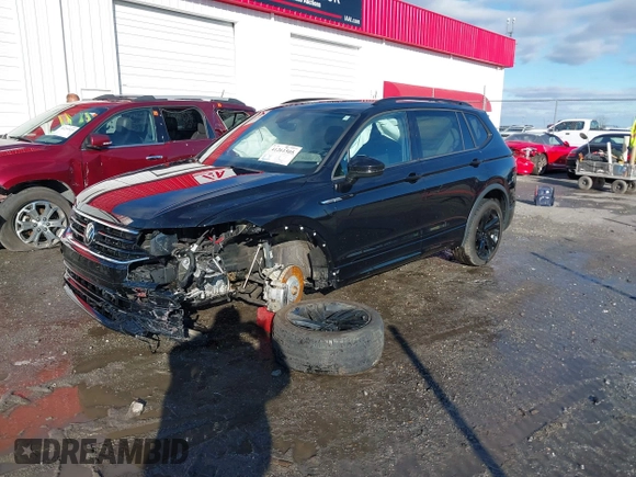 2023 Volkswagen Tiguan SE R-Line Black z VIN 3VVCB7AX5PM100499, wystawiony jako IAAI lot #41261505 z przebiegiem 26 677 mil mil oraz . Historia ofert i sprzedaży dostępna na DreamBid. Obrazek 18.