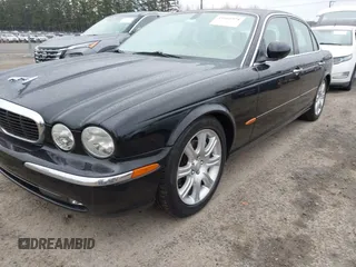 2004 Jaguar XJ with VIN SAJWA71C94SG29019, listed as a IAAI auction lot 41664978 with 133,546 mi miles. Bid and sale history available at carsss.com. Image 2.