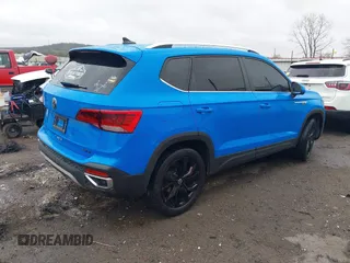 2023 Volkswagen Taos SE z VIN 3VVNX7B28PM305652, wystawiony jako IAAI lot #41892522 z przebiegiem 50 644 mil mil oraz . Historia ofert i sprzedaży dostępna na DreamBid. Obrazek 4.