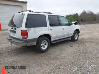 1999 Ford Explorer XLT z VIN 1FMZU32E1XZA80254, wystawiony jako IAAI lot #41453375 z przebiegiem 146 259 mil mil oraz . Historia ofert i sprzedaży dostępna na DreamBid. Obrazek 4.