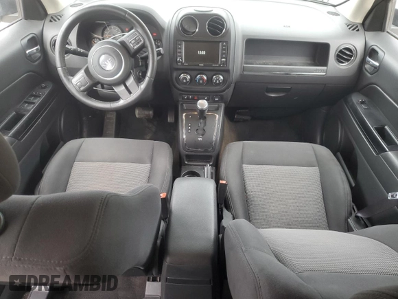 2014 Jeep Patriot Latitude with VIN 1C4NJRFB0ED649779, listed as a Copart auction lot 60444435 with 161,009 mi miles and Salvage title. Bid and sale history available at DreamBid. Image 8.