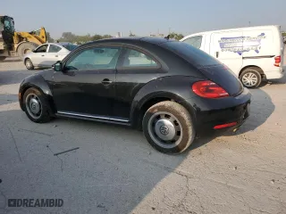 2012 Volkswagen Beetle 2.5L w/Sun PZEV with VIN 3VWJP7ATXCM606843, listed as a Copart auction lot 70894744 with 98,039 mi miles and Salvage Title. Bid and sale history available at carsss.com. Image 2.