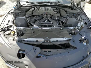 2023 BMW M8 Competition z VIN WBSAE0C04PCL03625, wystawiony jako Copart lot #52190975 z przebiegiem Nie podano mil oraz Nie do naprawy. Historia ofert i sprzedaży dostępna na DreamBid. Obrazek 11.
