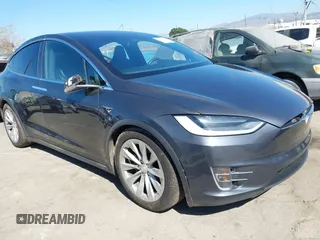 2018 Tesla Model X 75D with VIN 5YJXCBE26JF121937, listed as a IAAI auction lot 41652666 with 93,478 mi miles and . Bid and sale history available at carsss.com. Image 1.