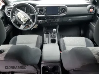 2021 Toyota Tacoma SR z VIN 3TYCZ5ANXMT050566, wystawiony jako Copart lot #57315615 z przebiegiem Nie podano mil oraz Szkoda całkowita • Salvage title. Historia ofert i sprzedaży dostępna na DreamBid. Obrazek 8.