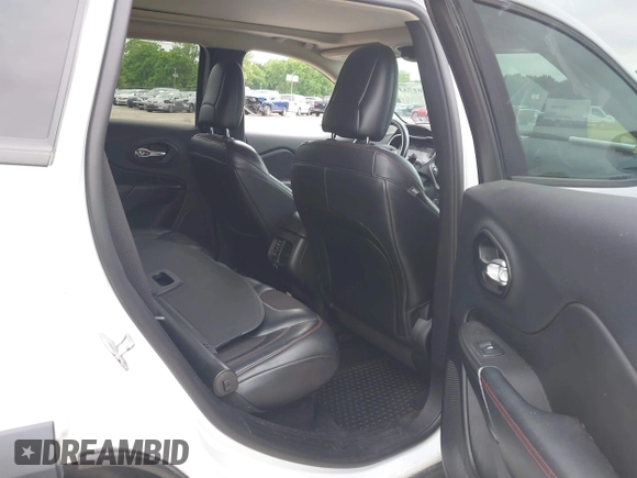 2014 Jeep Cherokee Trailhawk z VIN 1C4PJMBS4EW210719, wystawiony jako IAAI lot #42461733 z przebiegiem 134 096 mil mil oraz . Historia ofert i sprzedaży dostępna na DreamBid. Obrazek 8.