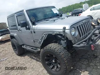 2016 Jeep Wrangler Black Bear with VIN 1C4AJWAG5GL258426, listed as a IAAI auction lot 42400914 with 128,606 mi miles and . Bid and sale history available at DreamBid. Image 1.