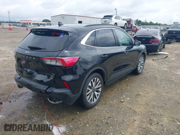 2021 Ford Escape Titanium Hybrid z VIN 1FMCU0DZ0MUA16798, wystawiony jako IAAI lot #42502086 z przebiegiem 107 250 mil mil oraz . Historia ofert i sprzedaży dostępna na DreamBid. Obrazek 4.