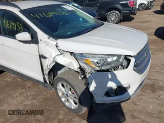 2017 Ford Escape SE z VIN 1FMCU9GD6HUB41900, wystawiony jako IAAI lot #41689153 z przebiegiem 85 975 mil mil oraz . Historia ofert i sprzedaży dostępna na DreamBid. Obrazek 6.