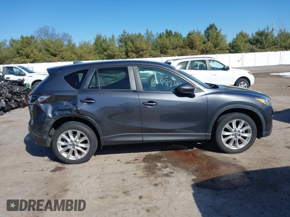 2014 Mazda CX-5 Grand Touring with VIN JM3KE4DY4E0320695, listed as a IAAI auction lot 41989350 with 169,391 mi miles and . Bid and sale history available at DreamBid. Image 14.