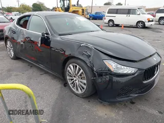 2015 Maserati Ghibli z VIN ZAM57XSA4F1151843, wystawiony jako IAAI lot #38392898 z przebiegiem 88 147 mil mil oraz . Historia ofert i sprzedaży dostępna na DreamBid. Obrazek 1.