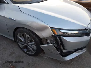 2018 Honda Clarity with VIN JHMZC5F15JC018312, listed as a IAAI auction lot 41354648 with 97,035 mi miles and . Bid and sale history available at DreamBid. Image 6.