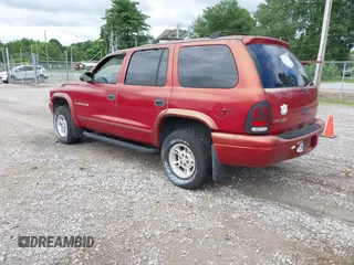 2000 Dodge Durango z VIN 1B4HS28N8YF101866, wystawiony jako IAAI lot #42377212 z przebiegiem 139 541 mil mil oraz . Historia ofert i sprzedaży dostępna na DreamBid. Obrazek 3.