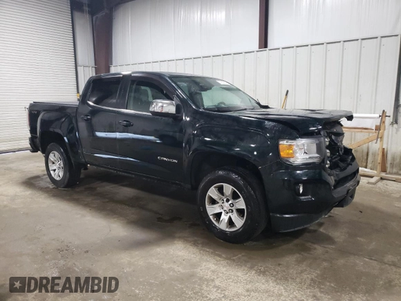 2015 GMC Canyon 4WD SLE with VIN 1GTG6BE38F1258880, listed as a Copart auction lot 57887664 with 142,346 mi miles and Salvage Title. Bid and sale history available at carsss.com. Image 4.