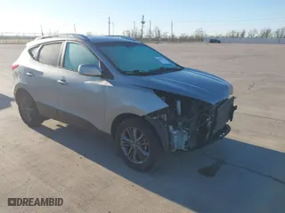 2015 Hyundai Tucson SE with VIN KM8JU3AG9FU044999, listed as a IAAI auction lot 41812633 with 105,924 mi miles. Bid and sale history available at carsss.com. Image 1.
