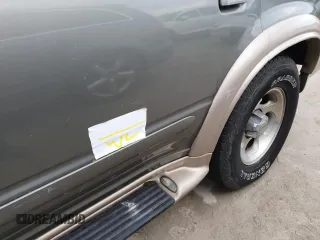 1999 Ford Explorer XL z VIN 1FMDU32E9XZB67958, wystawiony jako Copart lot #75350694 z przebiegiem 202 939 mil mil oraz Szkoda całkowita • Salvage title. Historia ofert i sprzedaży dostępna na DreamBid. Obrazek 13.