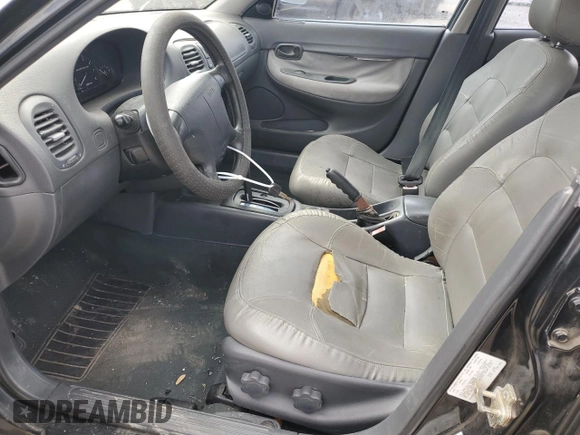 1999 Daewoo Nubira CDX z VIN KLAJB82Z5XK301054, wystawiony jako Copart lot #48227355 z przebiegiem 66 730 mil mil oraz Szkody całkowita. Historia ofert i sprzedaży dostępna na DreamBid. Obrazek 7.