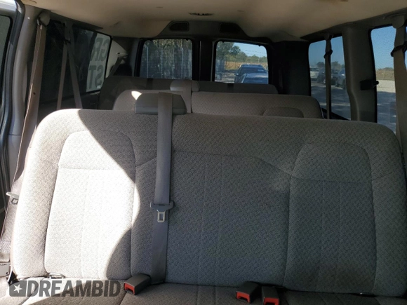 2013 Chevrolet Express Passenger 1LT z VIN 1GAZGYFG5D1190358, wystawiony jako Copart lot #75496574 z przebiegiem 114 340 mil mil oraz Szkoda całkowita • Salvage title. Historia ofert i sprzedaży dostępna na DreamBid. Obrazek 10.
