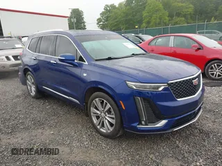 2023 Cadillac XT6 AWD Premium Luxury with VIN 1GYKPFRS1PZ180407, listed as a IAAI auction lot 42250662 with 21,465 mi miles and . Bid and sale history available at DreamBid. Image 1.