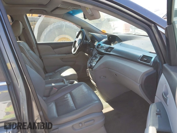 2012 Honda Odyssey EX-L with VIN 5FNRL5H69CB128585, listed as a IAAI auction lot 41695109 with 231,565 mi miles and . Bid and sale history available at carsss.com. Image 5.