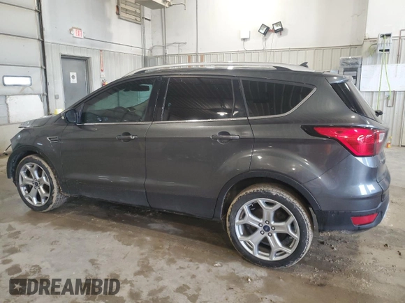 2019 Ford Escape Titanium with VIN 1FMCU0J91KUC02268, listed as a Copart auction lot 54150445 with 165,897 mi miles and Salvage title. Bid and sale history available at DreamBid. Image 2.